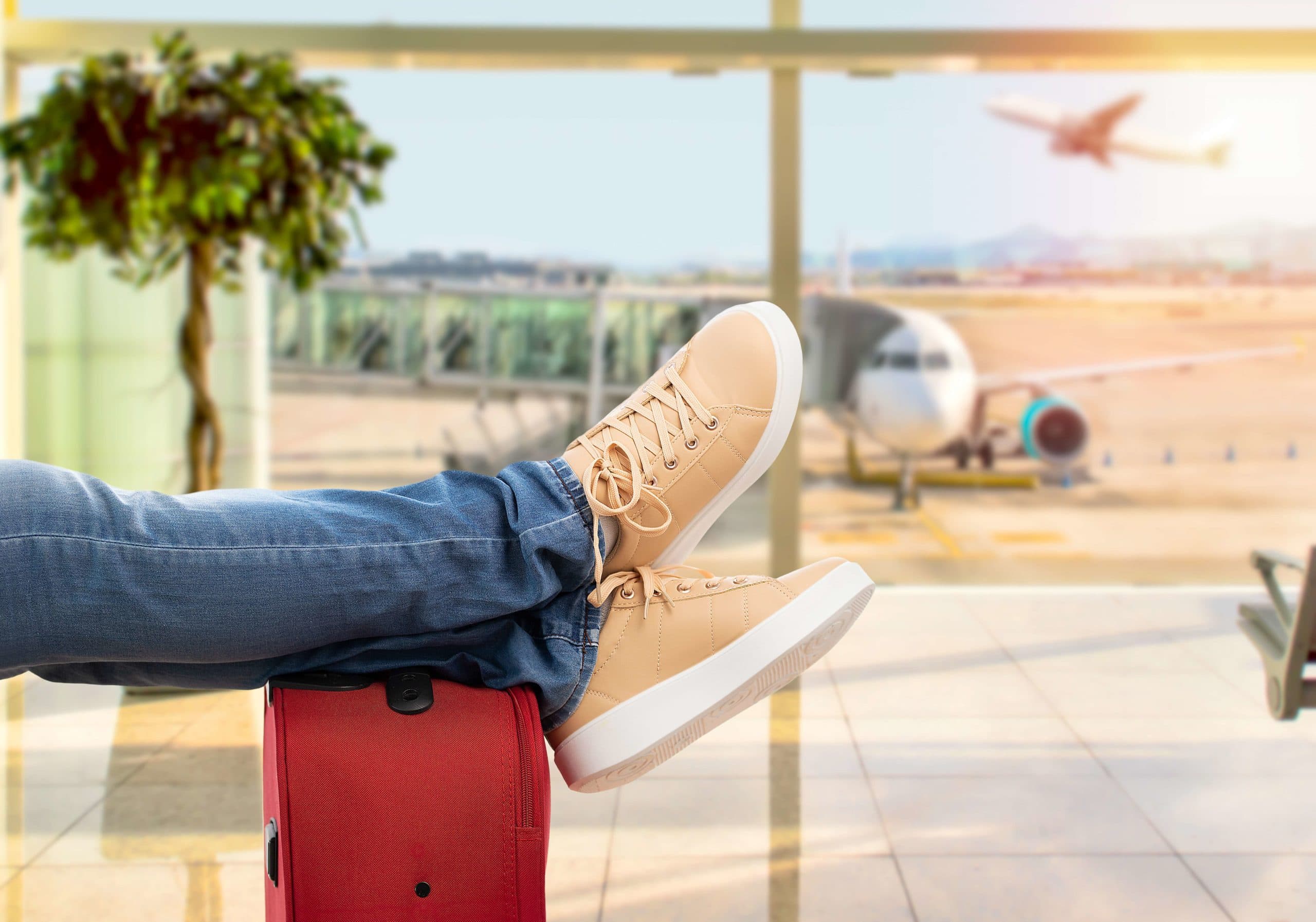 Close up of young man waiting for the plane at an airport