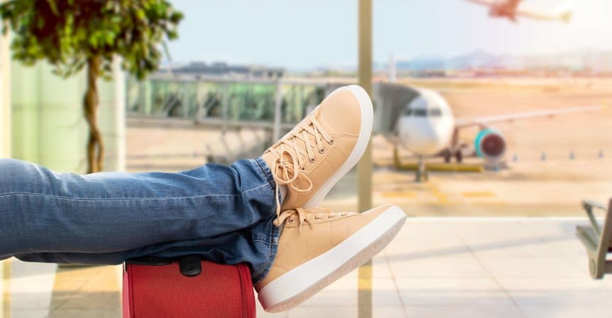 Close up of young man waiting for the plane at an airport