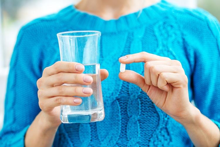 Receiving vitamins. Concept illness, colds, cure, fall and winter.