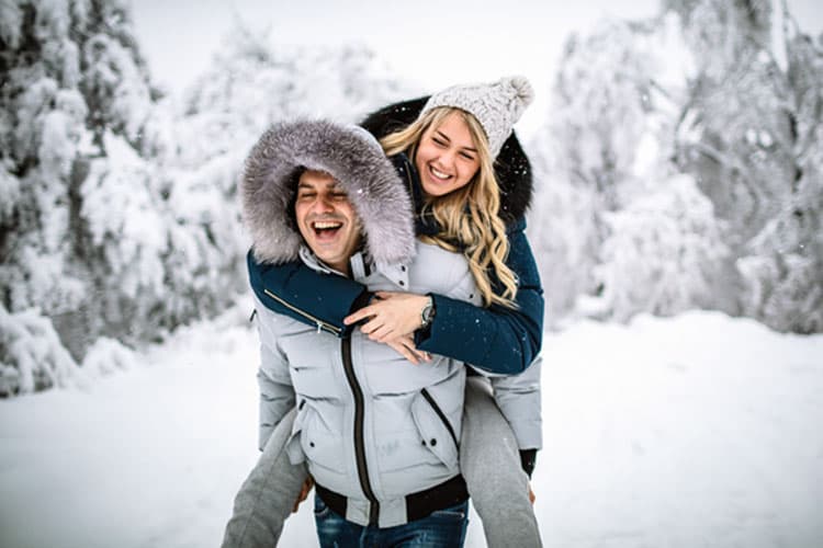 Photo of happy couple on a snowy day