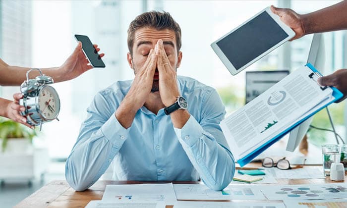 Portrait of a young businessman looking stressed out in a demanding office environment