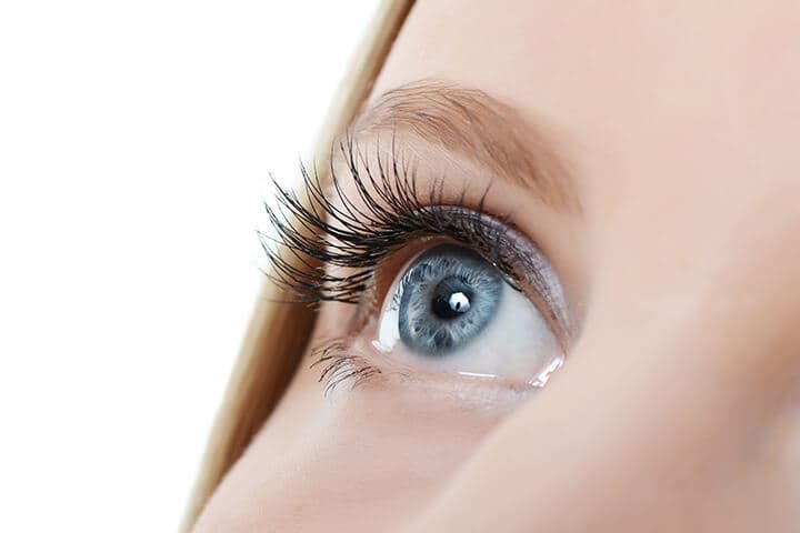 Female eye with long eyelashes close up